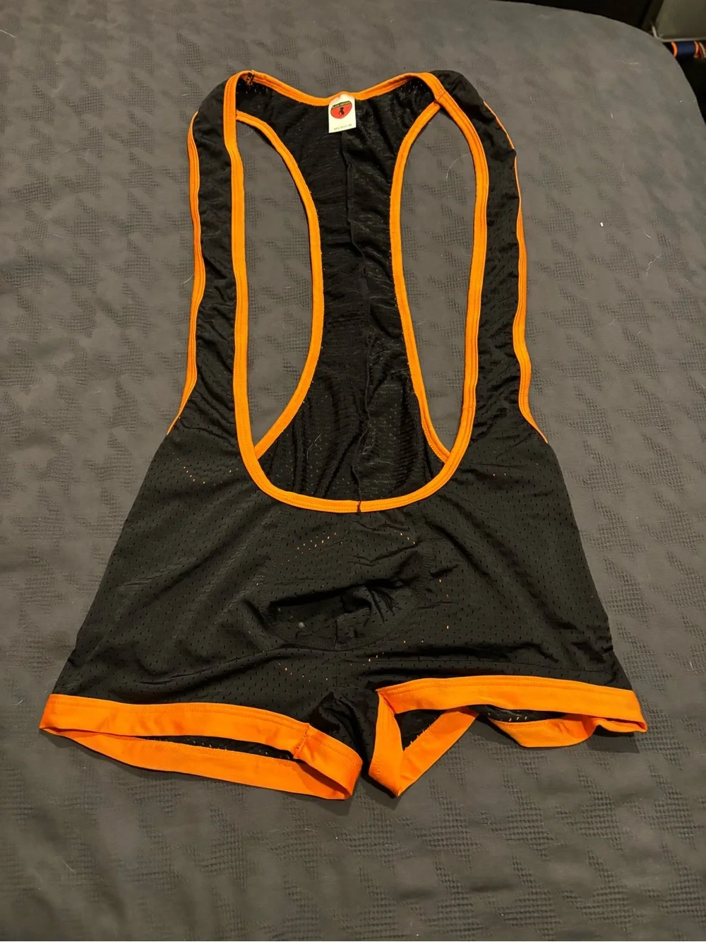 Black & Orange Men’s mesh singlet with Contrast Trim. Open butt